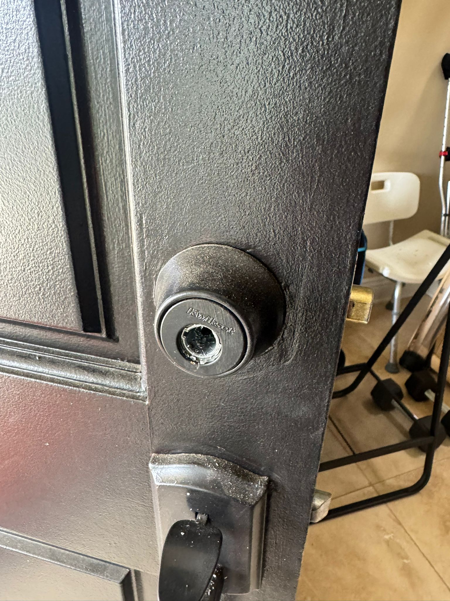Keywise Locksmith silver lever exit trim with keyed cylinder installed on a commercial door in Orange County, CA