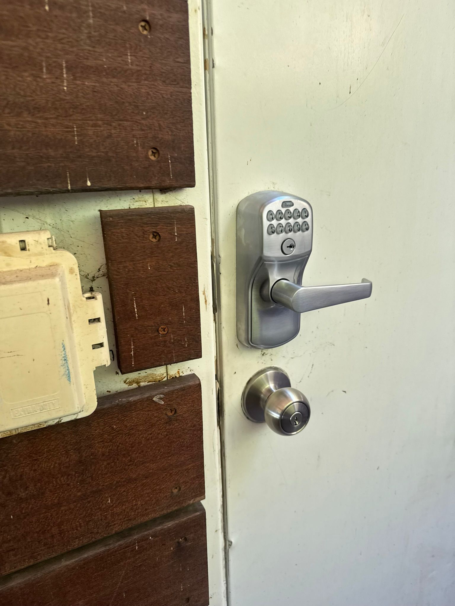 Keywise Locksmith wood double entry doors with brass handlesets serviced in Orange County, CA