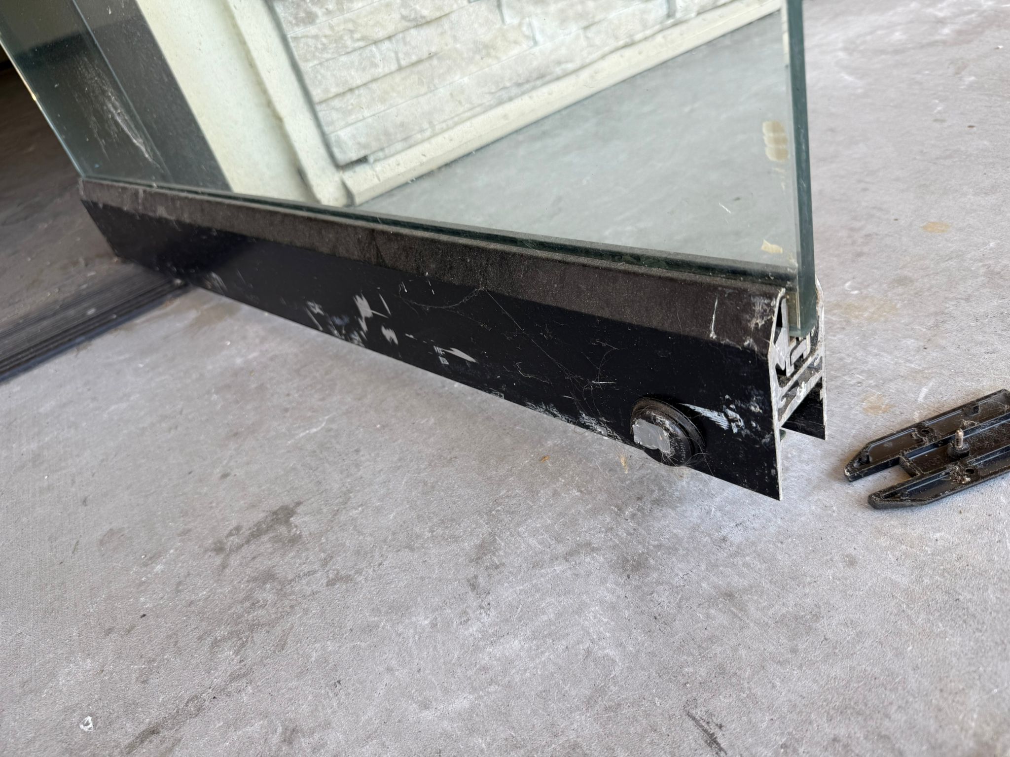 Keywise Locksmith glass storefront door bottom rail and lock rebuilt in Orange County, CA
