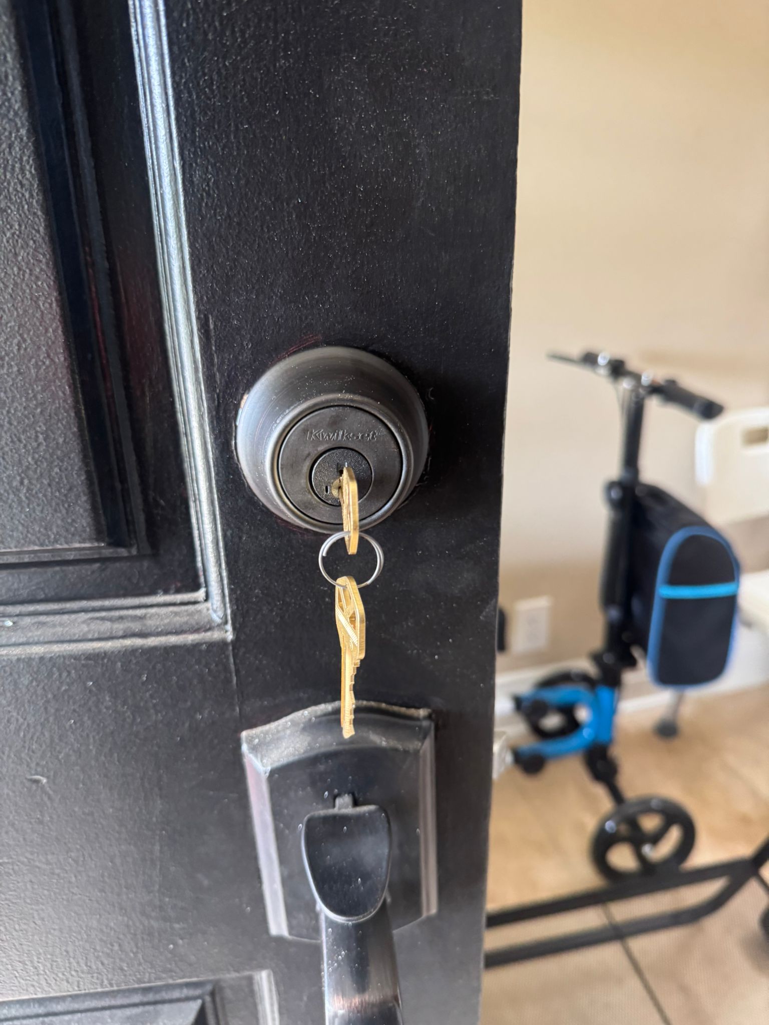 Keywise Locksmith Kwikset deadbolt rekeyed on a black residential front door in Orange County, CA